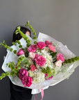 Bouquet “Jungle Flamingo” - peony roses, ranunculus, bells of Ireland, dianthus