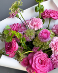 Bouquet “Jungle Flamingo” - peony roses, ranunculus, bells of Ireland, dianthus