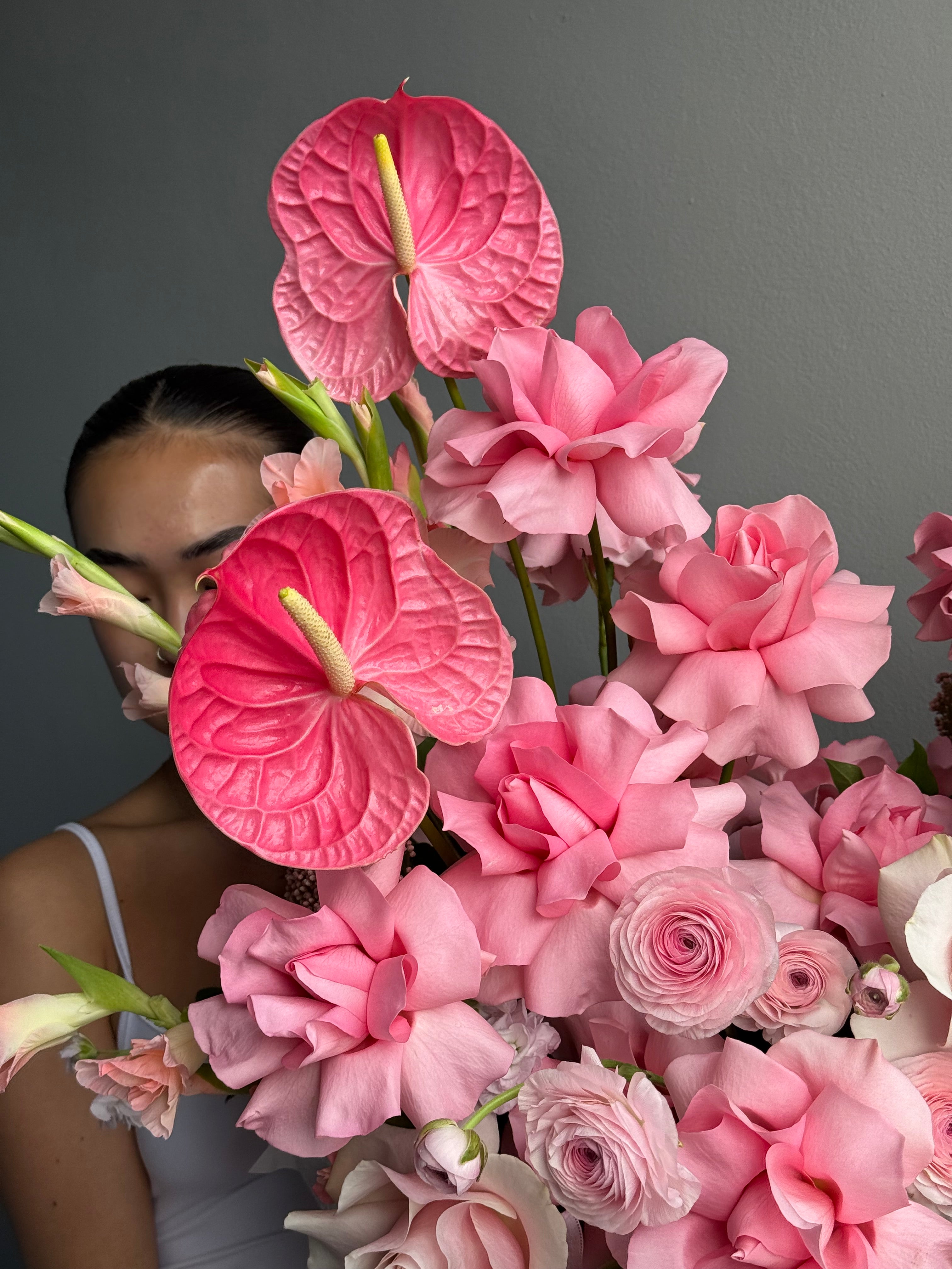 Flower Basket “Powder Shock” — anthurium, roses, ranunculus