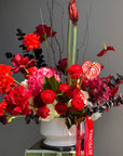 Interior Arrangement “Holiday Ruby Glow” — ranunculus, roses, hydrangea, anthurium, amaryllis