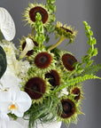 Interior Arrangement “Modern Muse” — orchid, anthurium, sunflower, calla lilies
