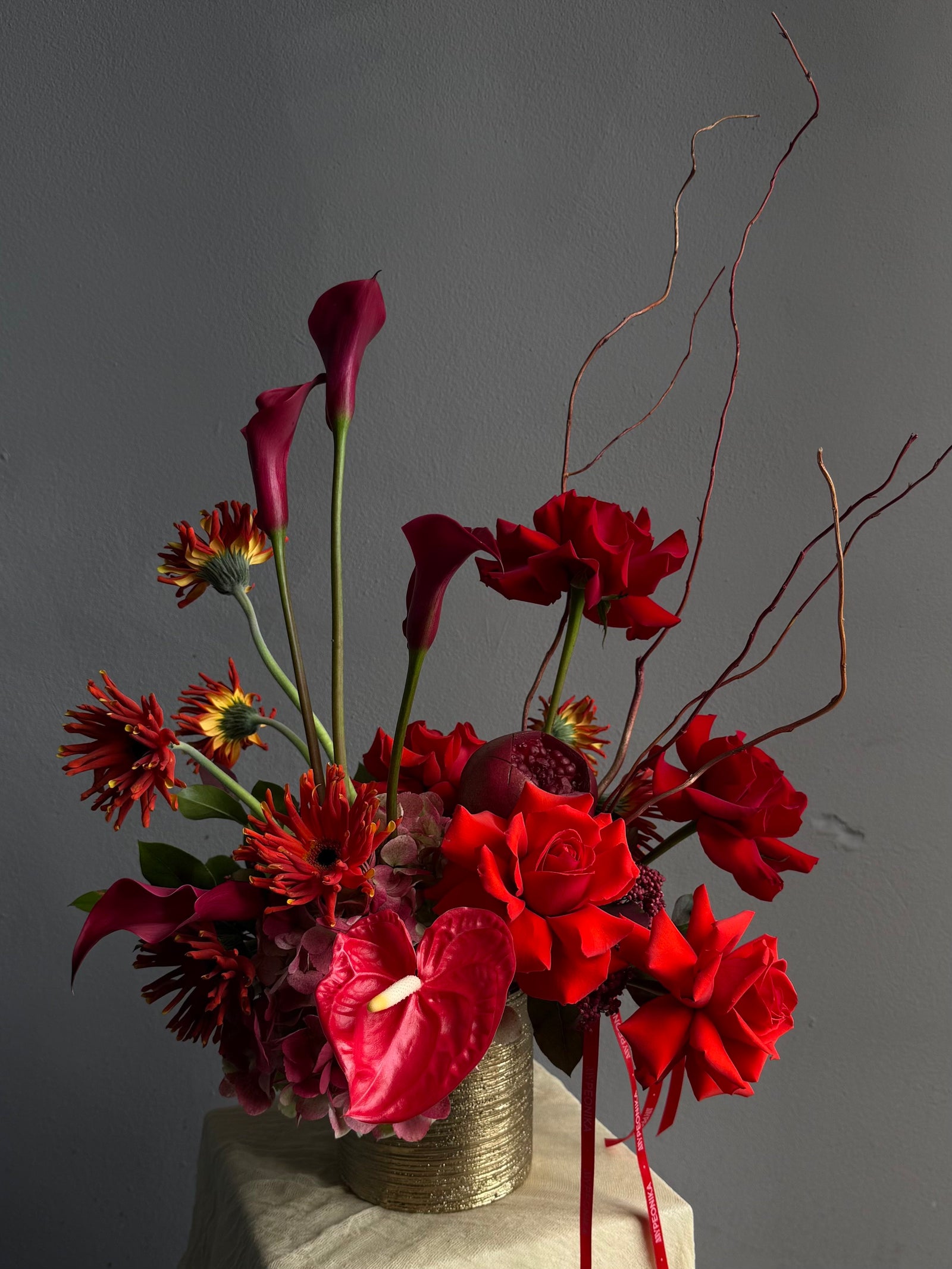 Vase Arrangement “Burning Love” — roses, hydrangea, anthurium, calla lily, gerberas, decorative pomegranate