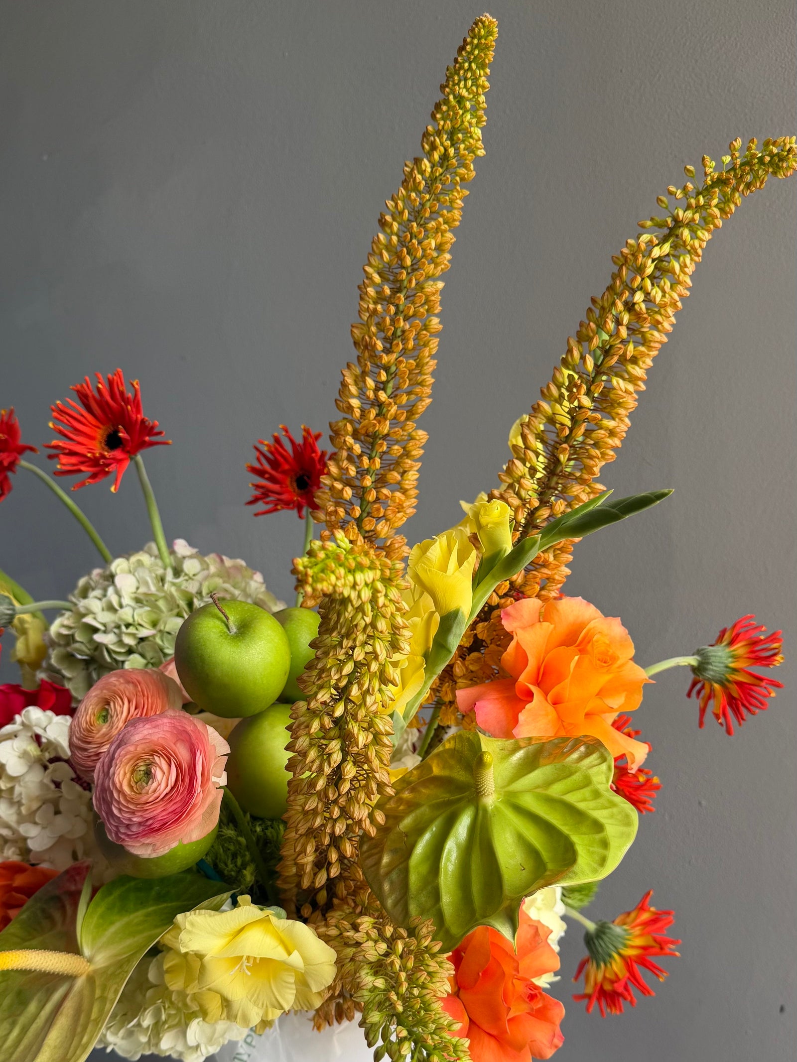 Flower Box “Object of Desire” — ranunculus, rose, anthurium, hydrangea, gerberas, decorative apple