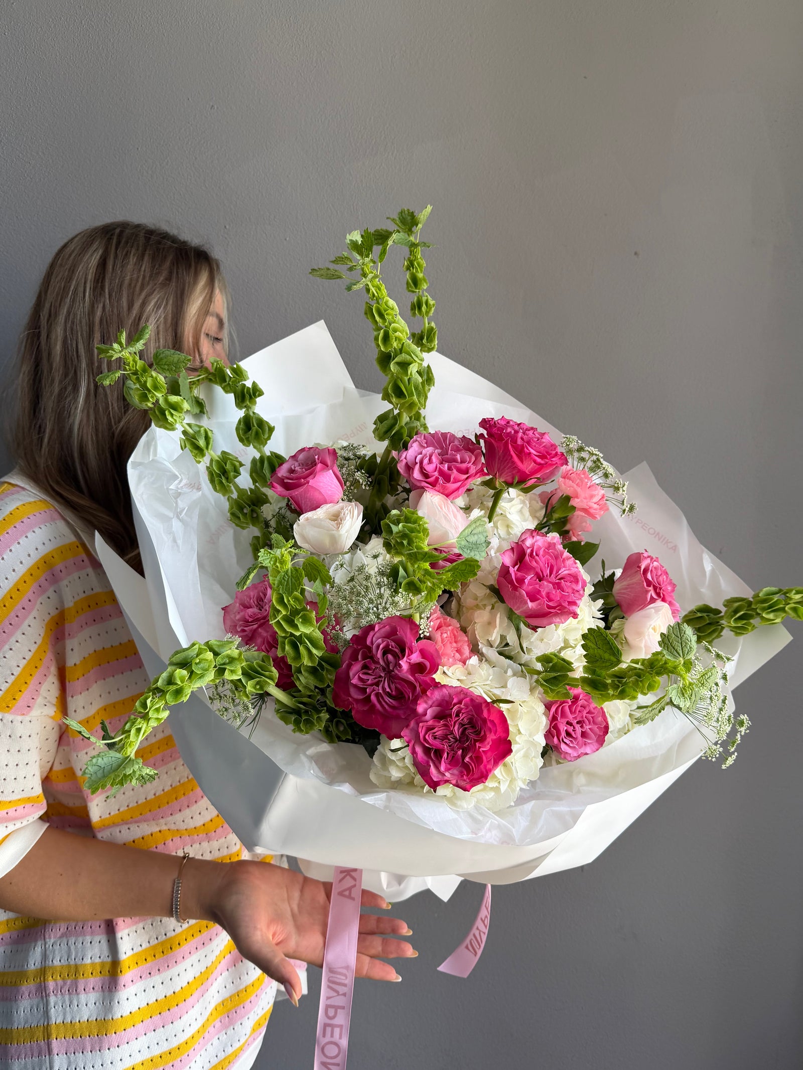 Bouquet “Jungle Flamingo” - peony roses, ranunculus, bells of Ireland, dianthus