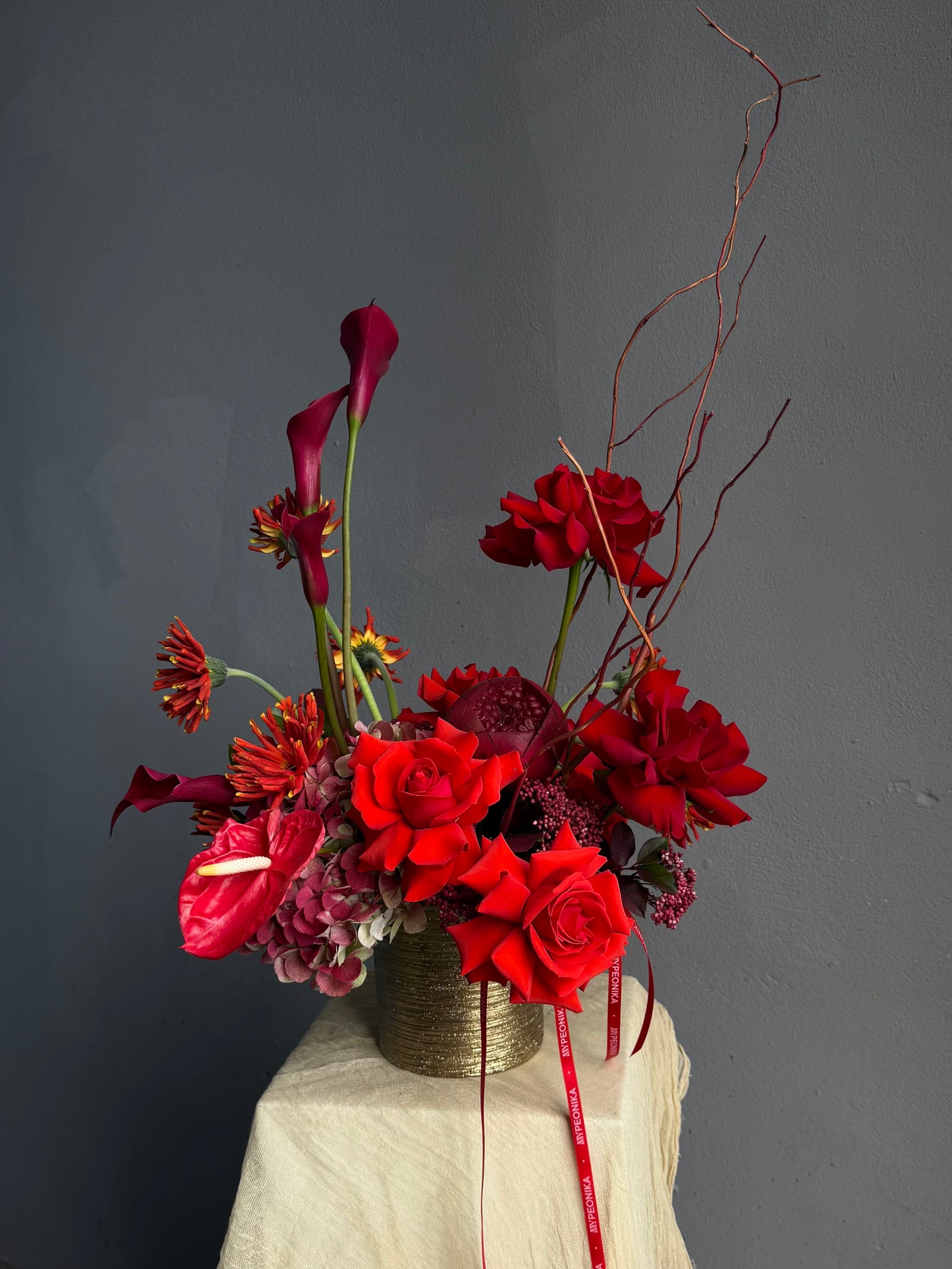 Vase Arrangement “Burning Love” — roses, hydrangea, anthurium, calla lily, gerberas, decorative pomegranate