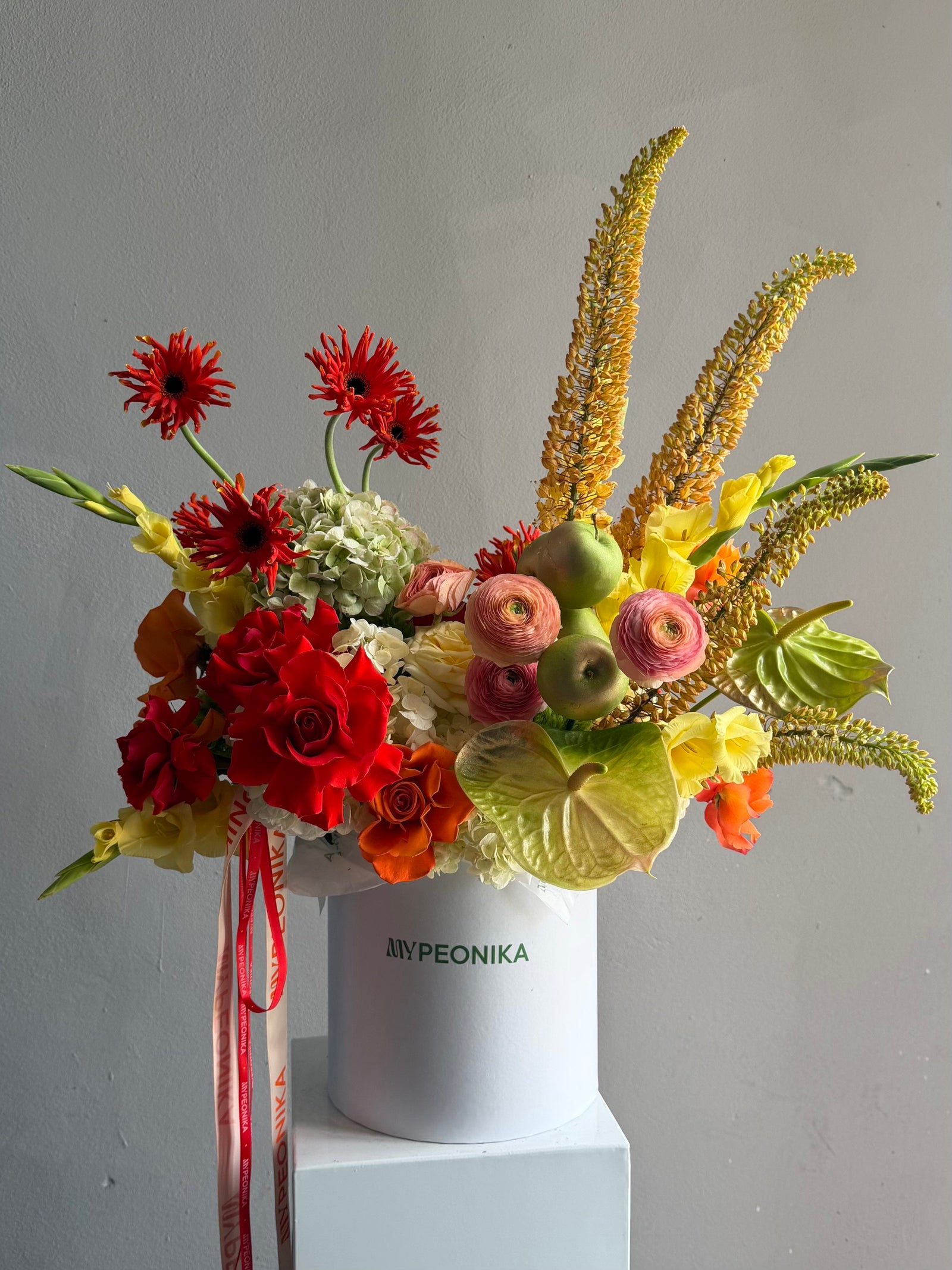 Flower Box “Object of Desire” — ranunculus, rose, anthurium, hydrangea, gerberas, decorative apple