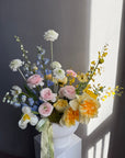 Interior Arrangement “Color Therapy” — ranunculus, roses, delphinium & seasonal blooms