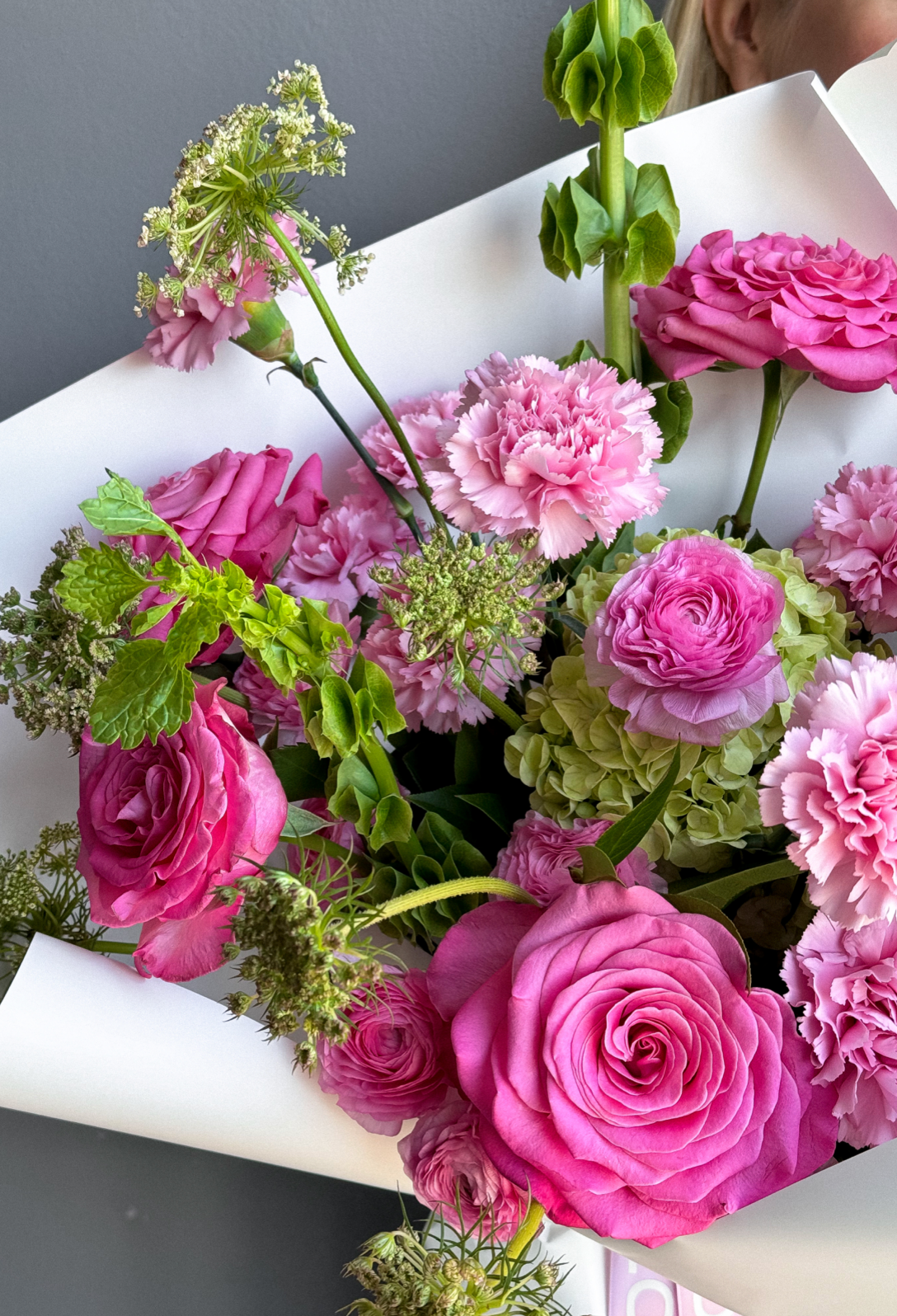 Bouquet “Jungle Flamingo” - peony roses, ranunculus, bells of Ireland, dianthus