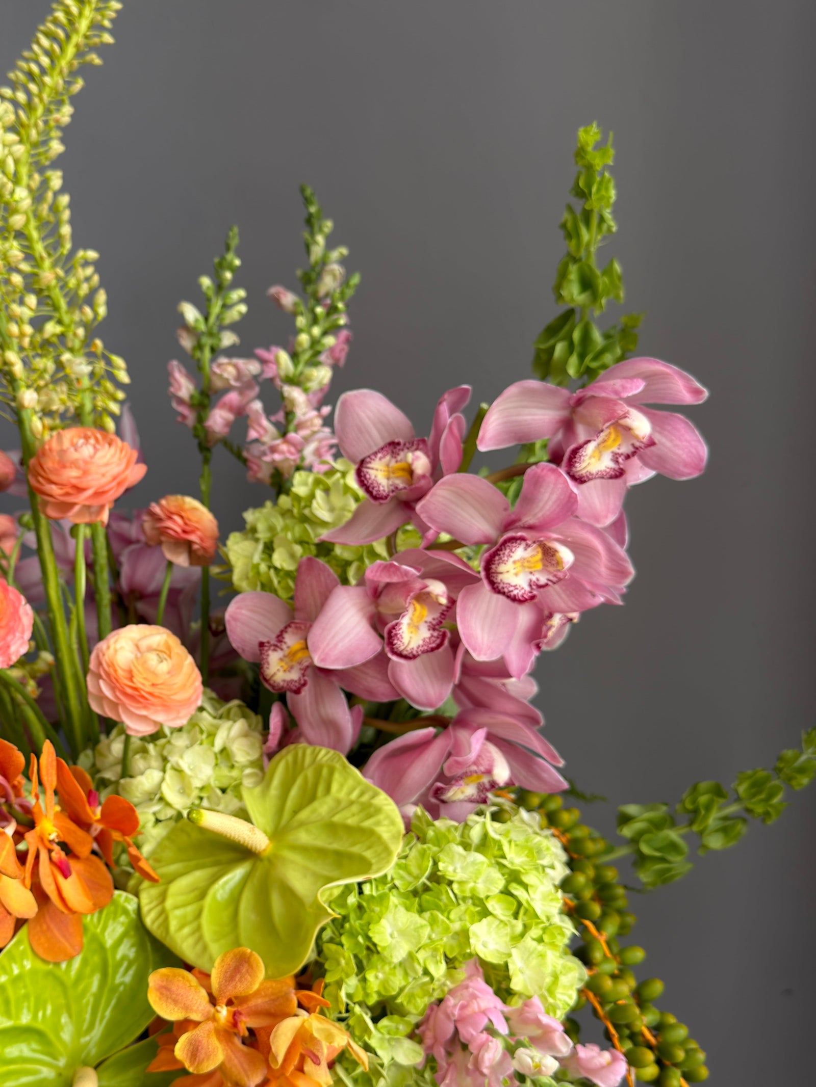 Vase Arrangement “Sunset Theory” — ranunculus, anthurium, hydrangea, orchids
