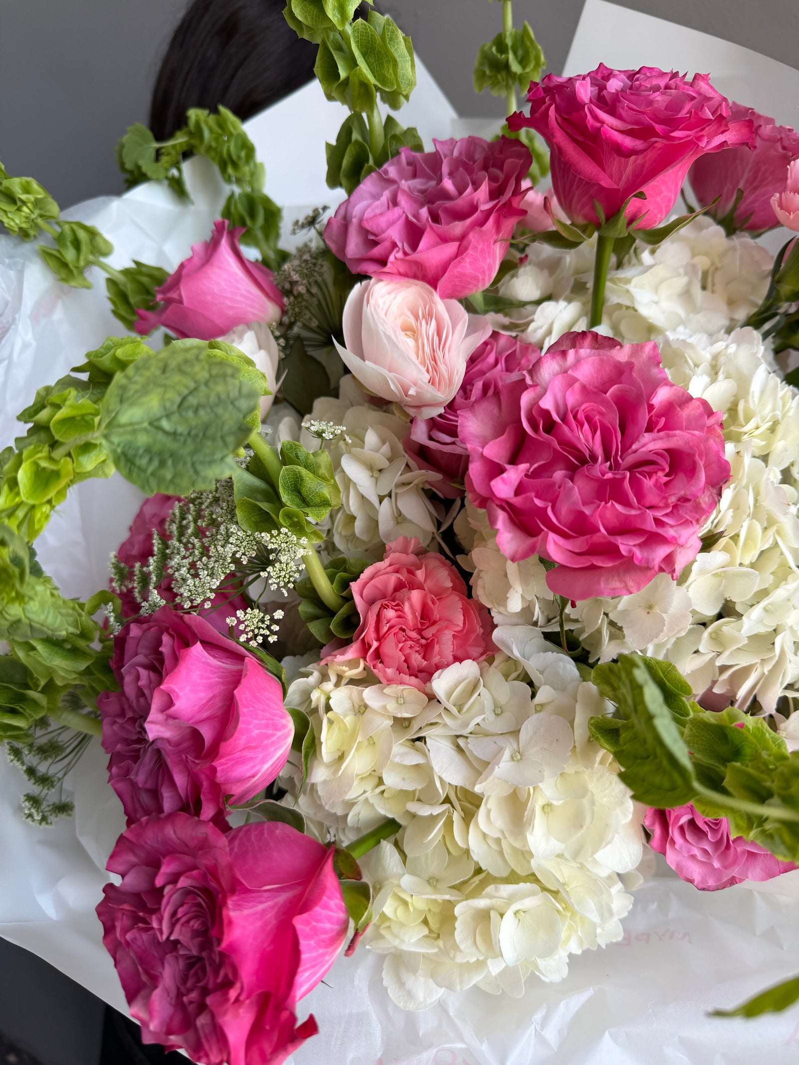 Bouquet “Jungle Flamingo” - peony roses, ranunculus, bells of Ireland, dianthus