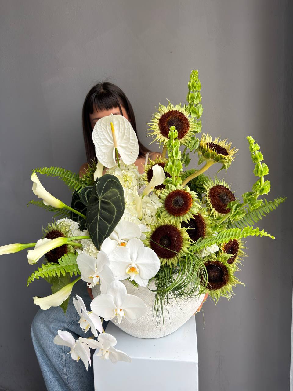 Interior Arrangement “Modern Muse” — orchid, anthurium, sunflower, calla lilies