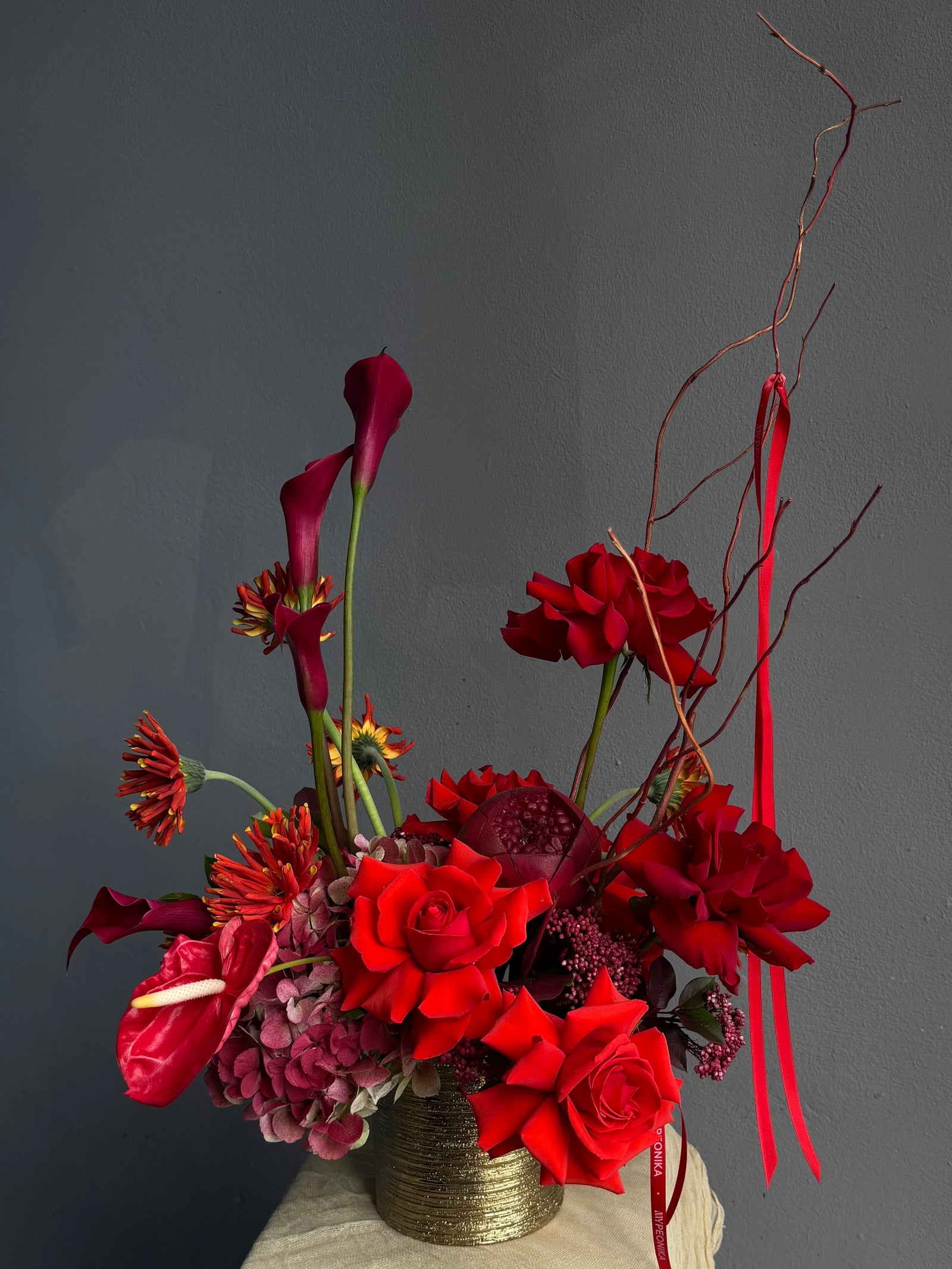 Vase Arrangement “Burning Love” — roses, hydrangea, anthurium, calla lily, gerberas, decorative pomegranate