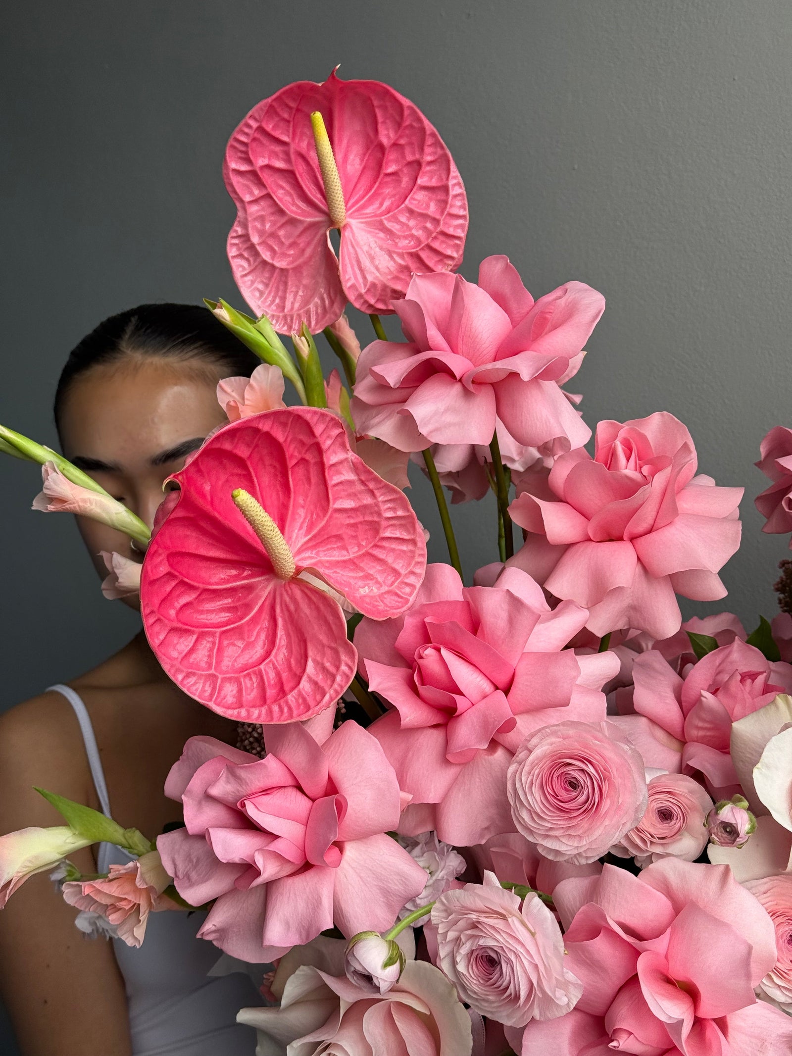 Flower Basket “Powder Shock” — anthurium, roses, ranunculus, gladioli