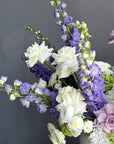Vase Arrangement “Summer Poetry” — delphinium, peonies, roses, viburnum, lisianthus