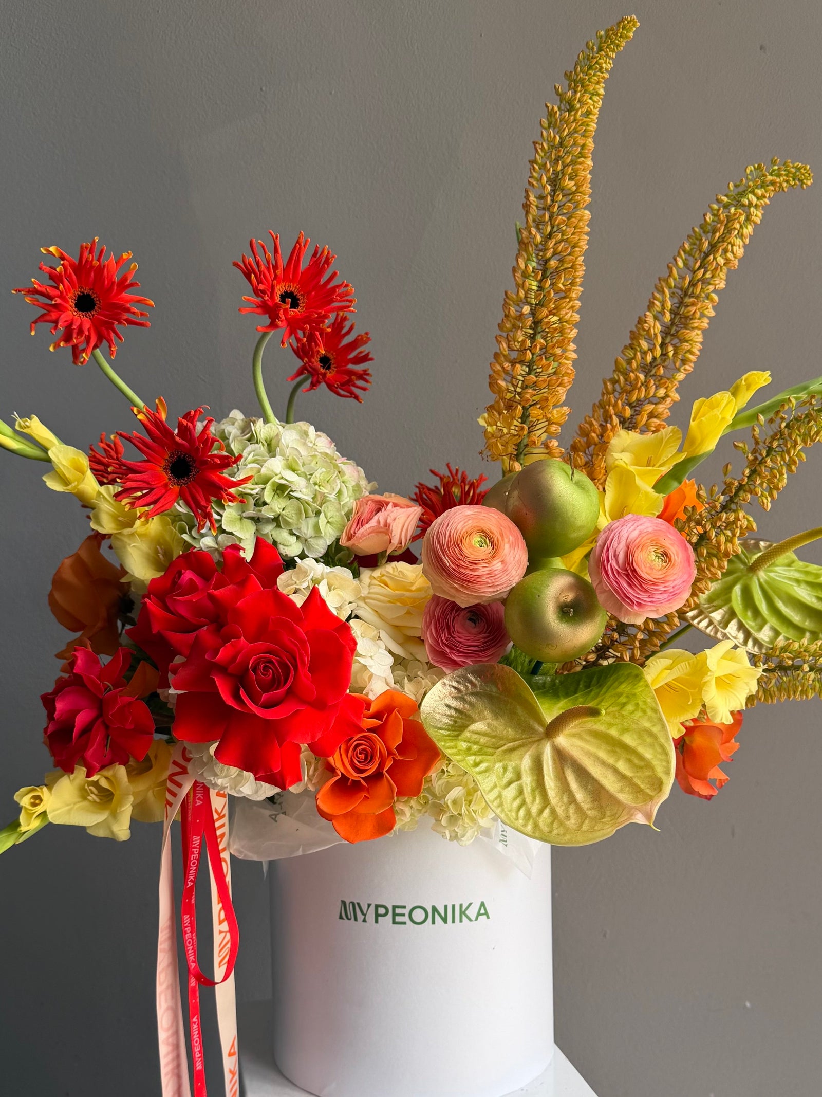 Flower Box “Object of Desire” — ranunculus, rose, anthurium, hydrangea, gerberas, decorative apple