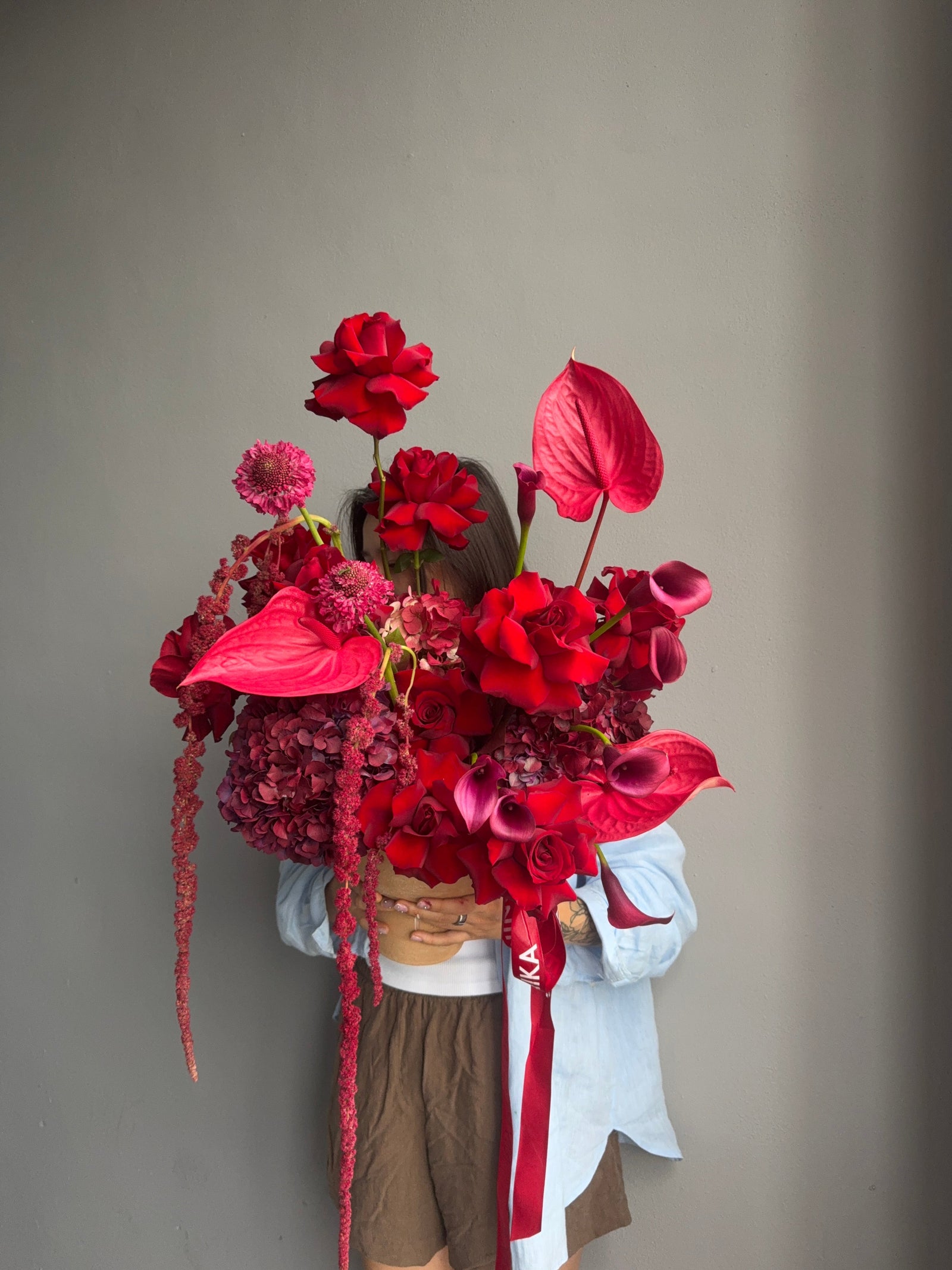 Flower Arrangement in a pot “Terracotta Flame” — anthurium, amaranth, calla lilies, roses