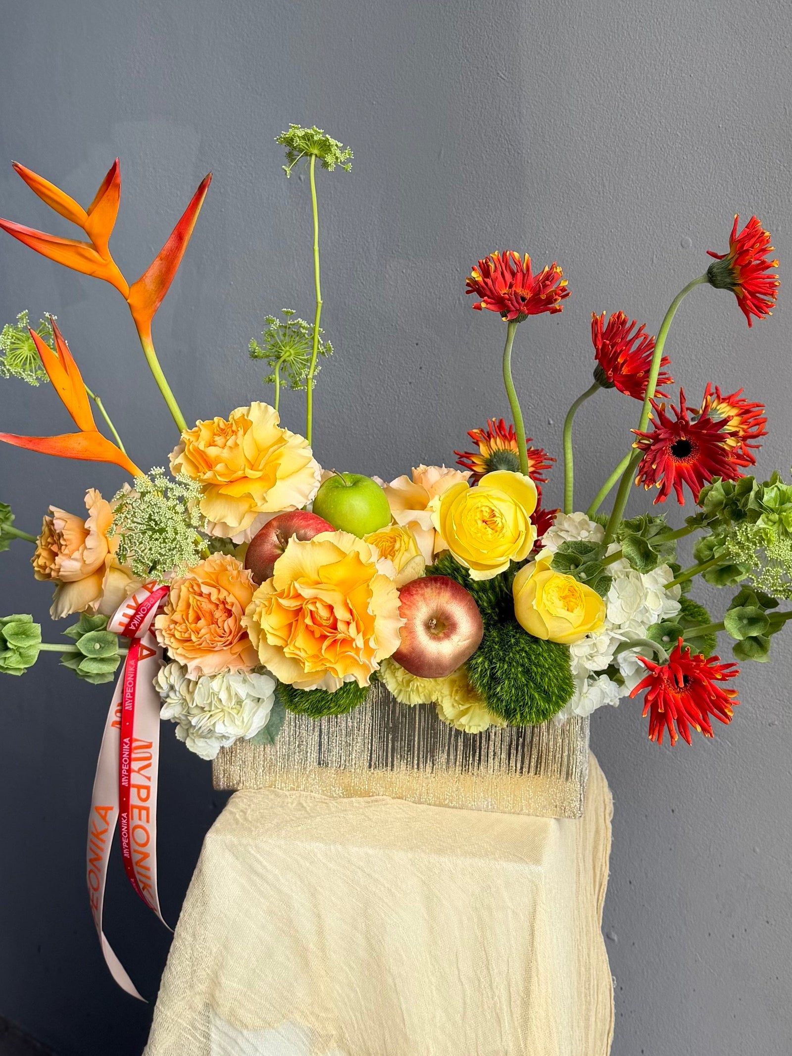 Vase Arrangement “No Beige” — gerberas, roses, green dianthus, hydrangea, viburnum, molucella, decorative apple