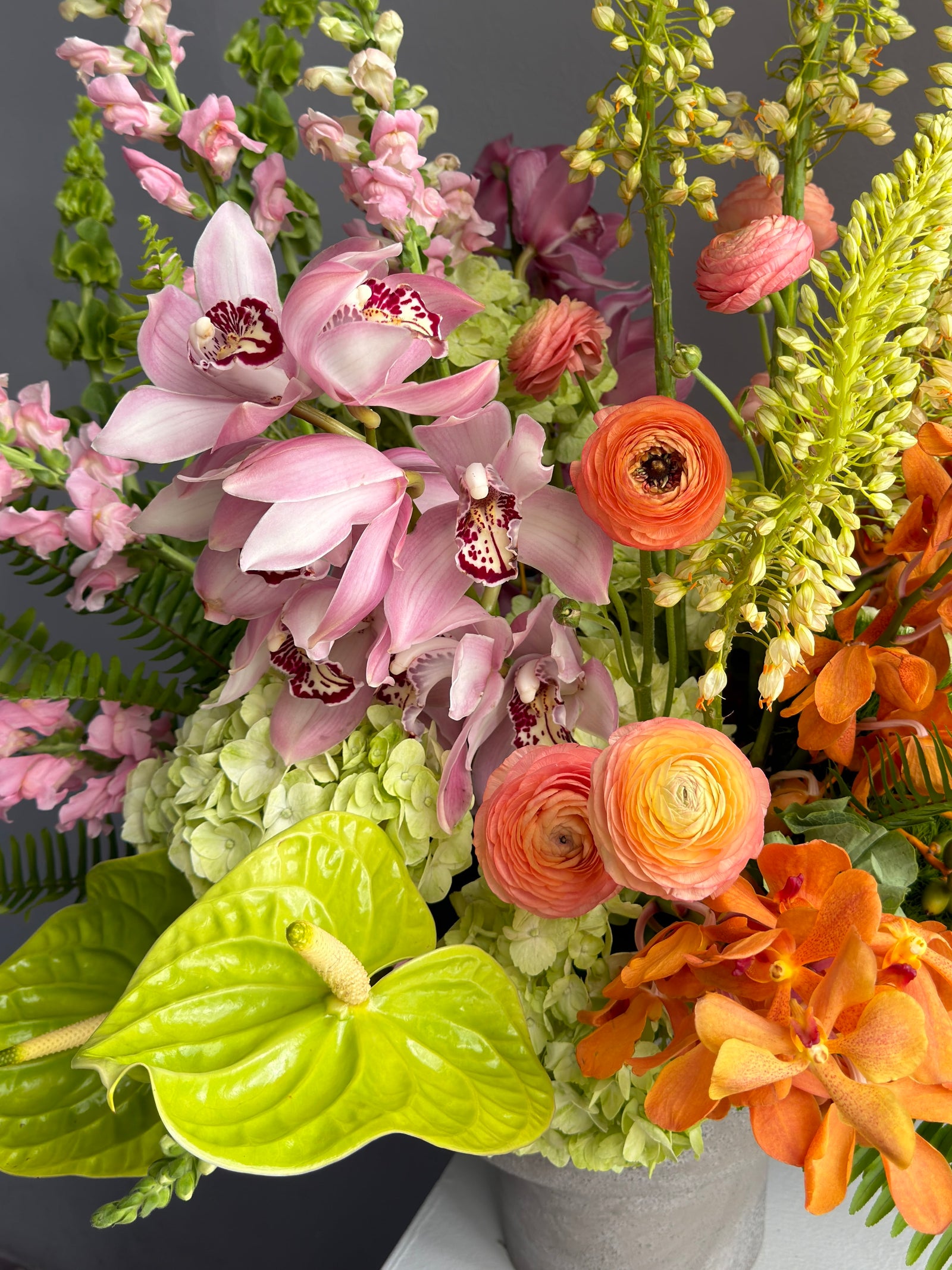 Vase Arrangement “Sunset Theory” — ranunculus, anthurium, hydrangea, orchids