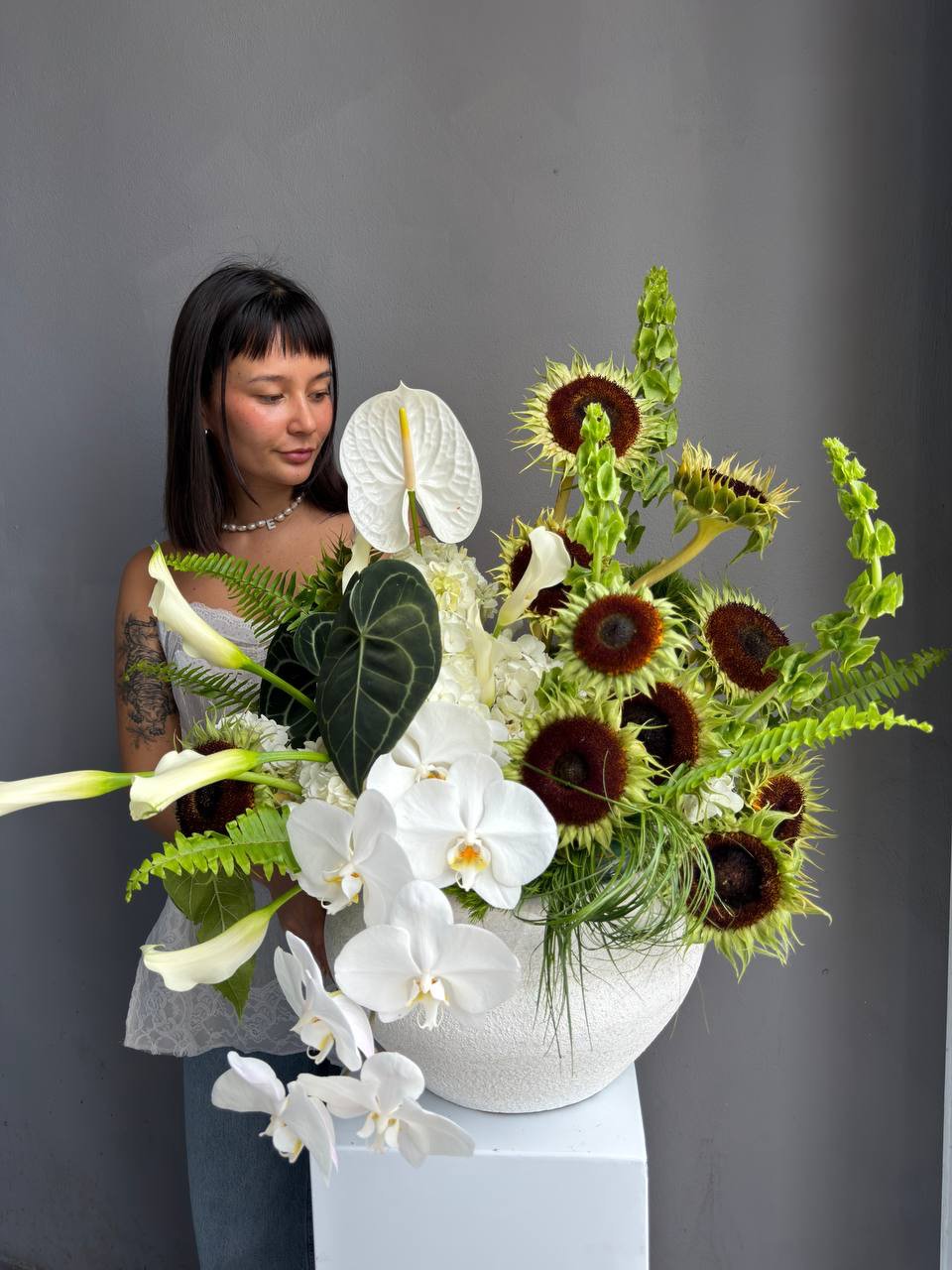 Interior Arrangement “Modern Muse” — orchid, anthurium, sunflower, calla lilies