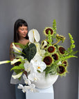 Interior Arrangement “Modern Muse” — orchid, anthurium, sunflower, calla lilies