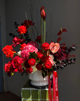 Interior Arrangement “Holiday Ruby Glow” — ranunculus, roses, hydrangea, anthurium, amaryllis