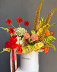 Flower Box “Object of Desire” — ranunculus, rose, anthurium, hydrangea, gerberas, decorative apple