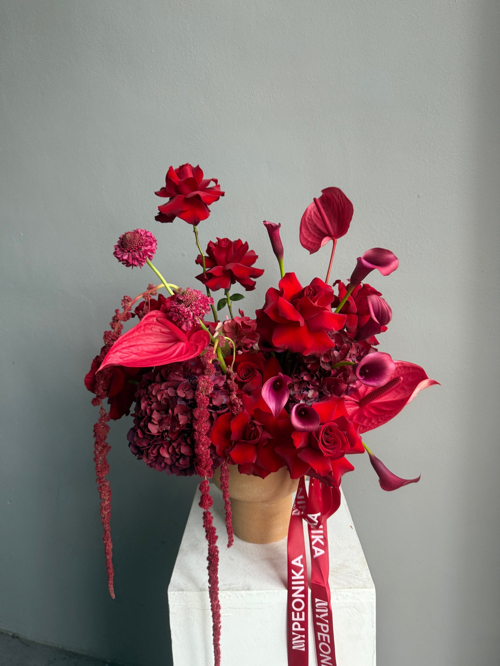 Flower Arrangement in a pot “Terracotta Flame” — anthurium, amaranth, calla lilies, roses