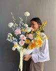 Interior Arrangement “Color Therapy” — ranunculus, roses, delphinium & seasonal blooms