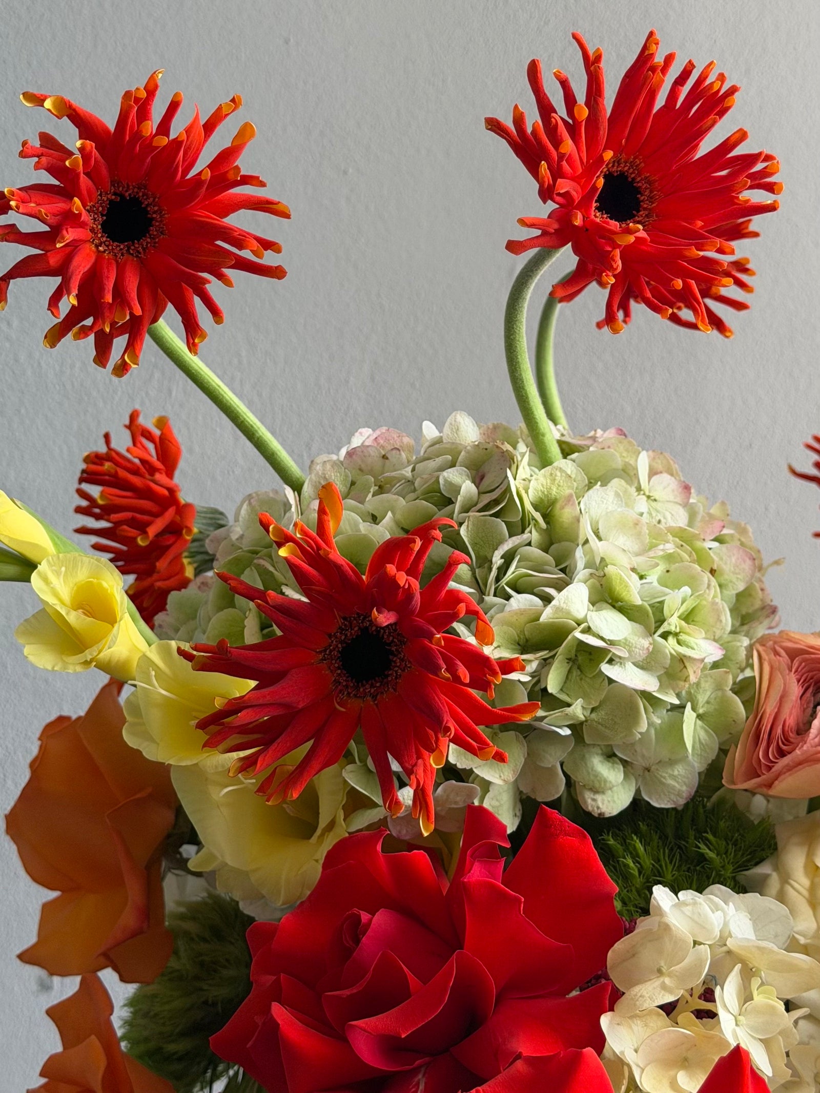 Flower Box “Object of Desire” — ranunculus, rose, anthurium, hydrangea, gerberas, decorative apple