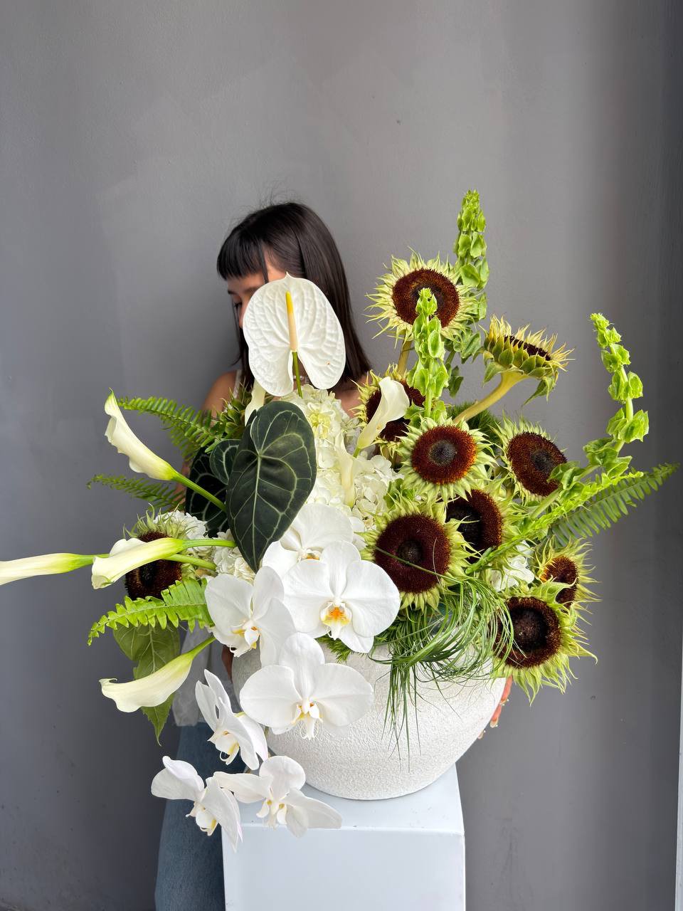 Interior Arrangement “Modern Muse” — orchid, anthurium, sunflower, calla lilies