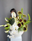 Interior Arrangement “Modern Muse” — orchid, anthurium, sunflower, calla lilies