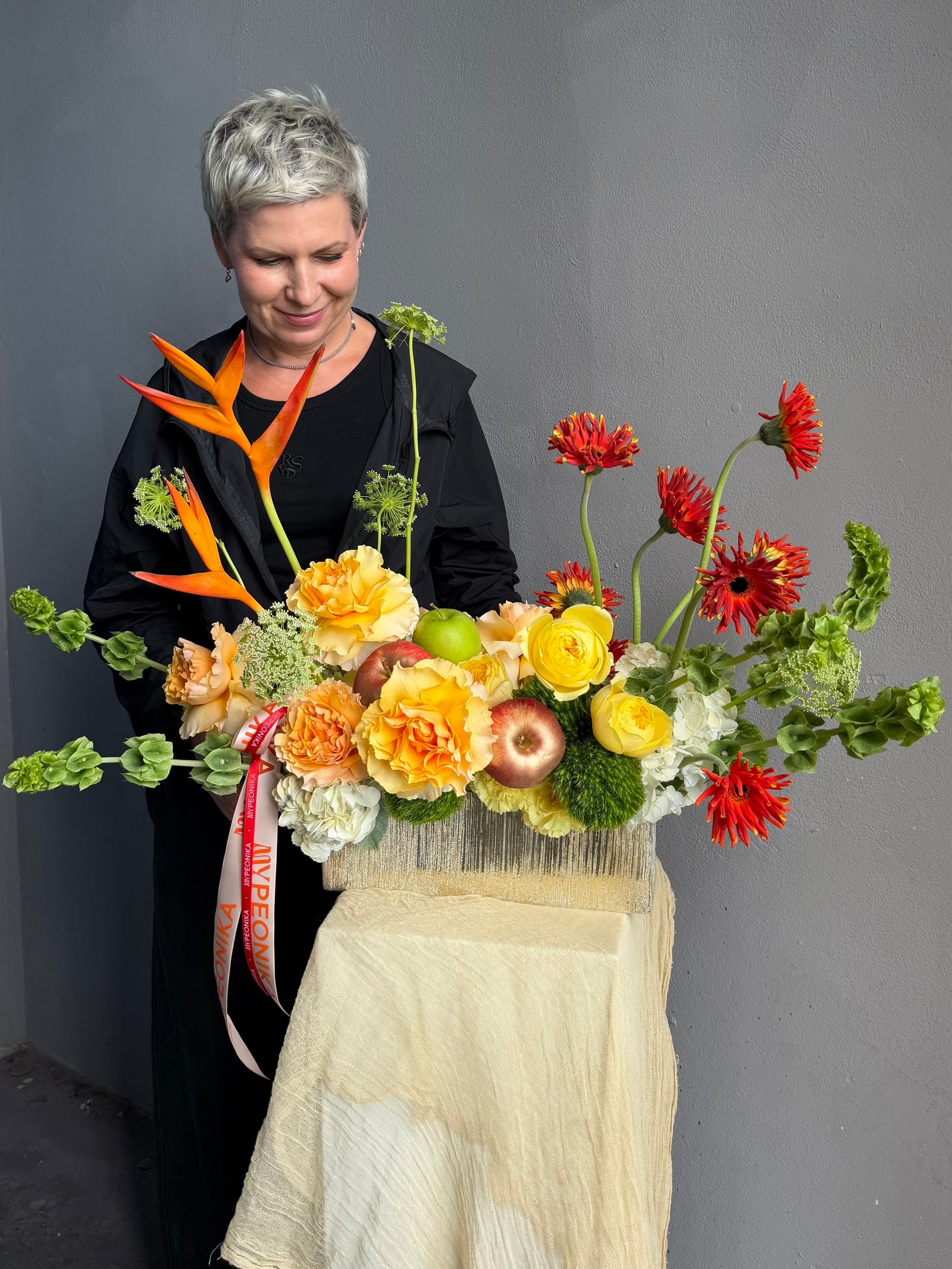 Vase Arrangement “No Beige” — gerberas, roses, green dianthus, hydrangea, viburnum, molucella, decorative apple