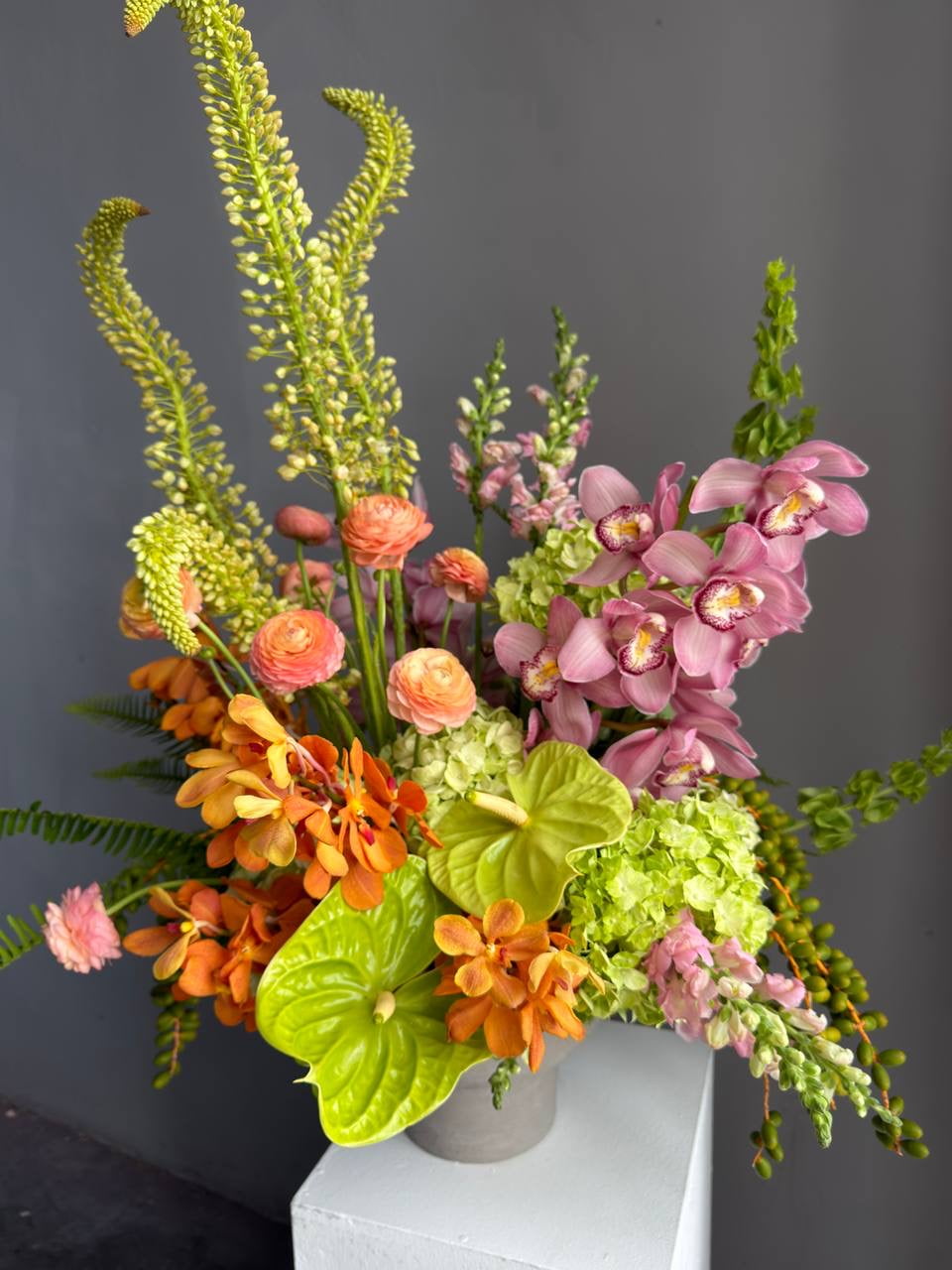 Vase Arrangement “Sunset Theory” — ranunculus, anthurium, hydrangea, orchids