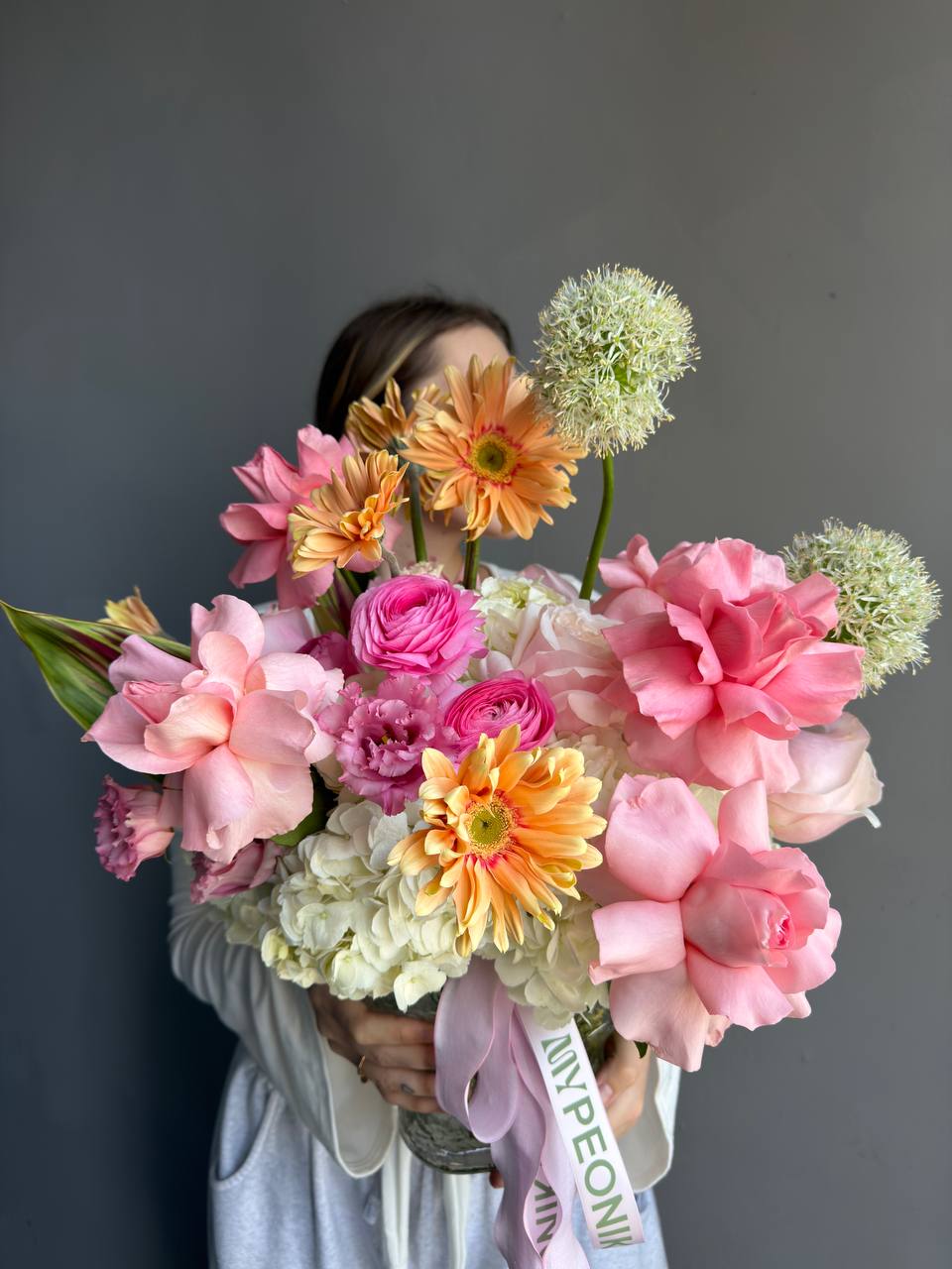 Vase Arrangement “Living in Color” — hydrangeas, gerberas, roses, lisianthus, allium, ranunculus
