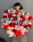 Heart-shaped flower box “Too hot to handle” - anemones, ranunculus, roses