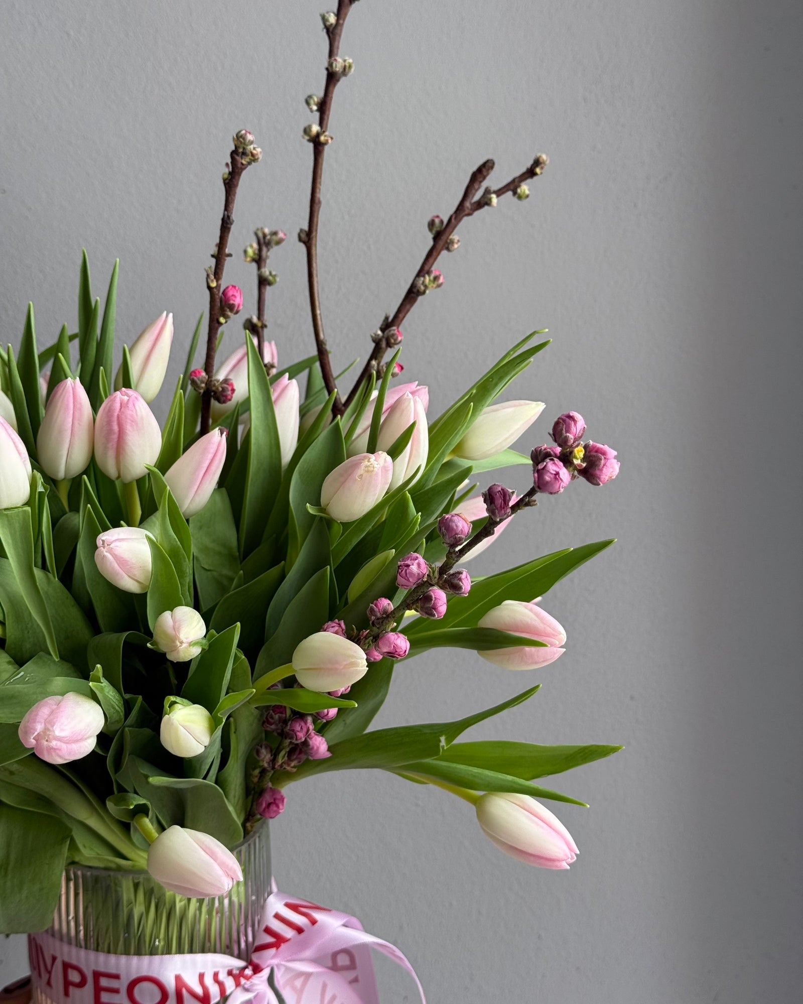 Bouquet in a Vase "Tulip Seduction" - 45 tulips, apricot blossoms, vase