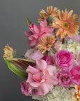 Vase Arrangement “Living in Color” — hydrangeas, gerberas, roses, lisianthus, allium, ranunculus