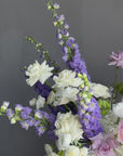 Vase Arrangement “Summer Poetry” — delphinium, peonies, roses, viburnum, lisianthus