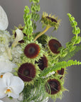 Interior Arrangement “Modern Muse” — orchid, anthurium, sunflower, calla lilies